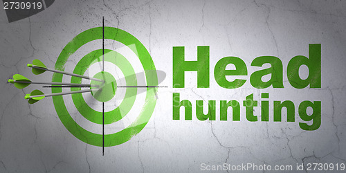 Image of Business concept: target and Head Hunting on wall background