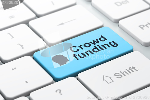 Image of Finance concept: Head and Crowd Funding on computer keyboard background