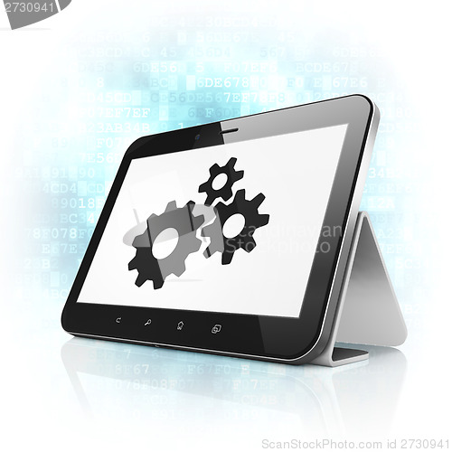 Image of Information concept: Gears on tablet pc computer