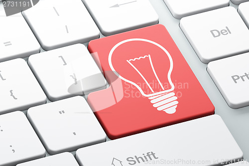 Image of Business concept: Light Bulb on computer keyboard background