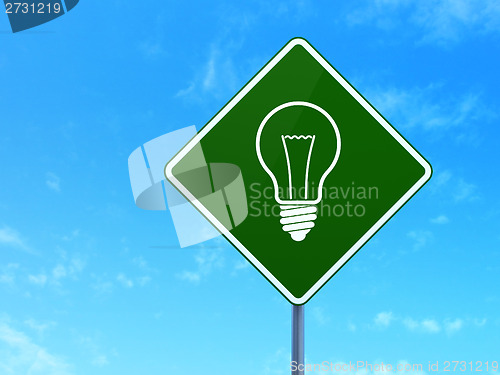 Image of Business concept: Light Bulb on road sign background
