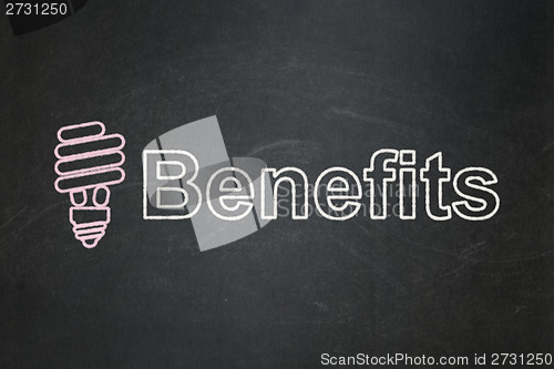 Image of Finance concept: Energy Saving Lamp and Benefits on chalkboard background