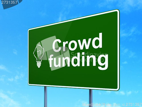 Image of Finance concept: Crowd Funding and Light Bulb on road sign background
