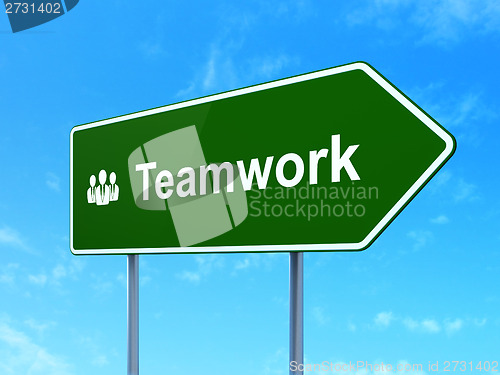 Image of Finance concept: Teamwork and Business People on road sign background