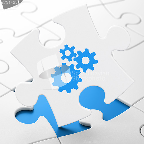 Image of Web design concept: Gears on puzzle background