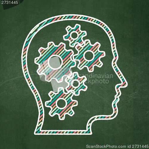 Image of Information concept: Head With Gears on chalkboard background
