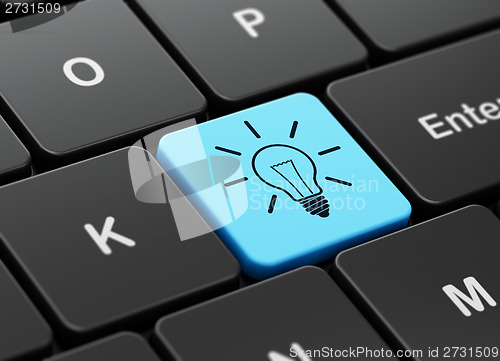 Image of Business concept: Light Bulb on computer keyboard background