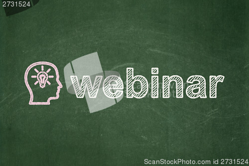 Image of Education concept: Head With Lightbulb and Webinar on chalkboard background