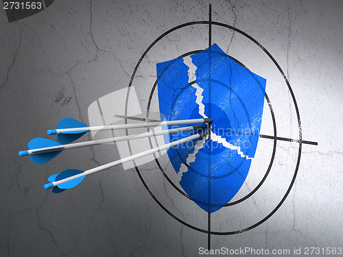 Image of Security concept: arrows in Broken Shield target on wall background