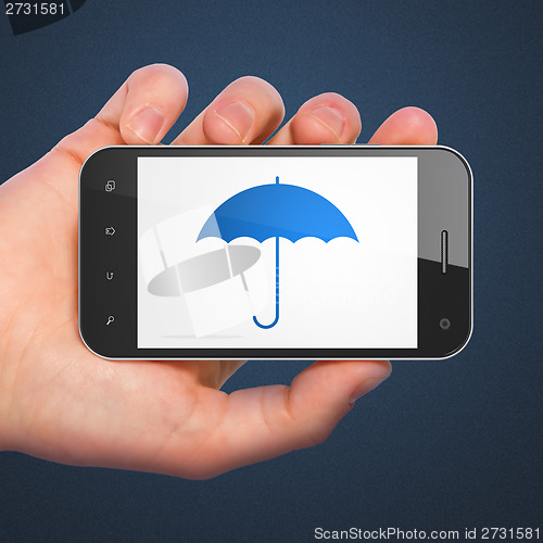 Image of Privacy concept: Umbrella on smartphone