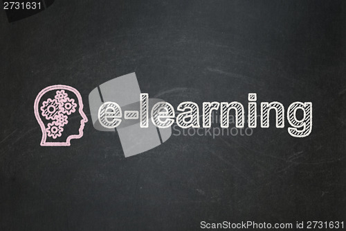 Image of Education concept: Head With Gears and E-learning on chalkboard background