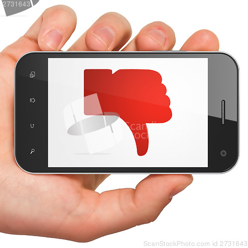 Image of Social network concept: Thumb Down on smartphone