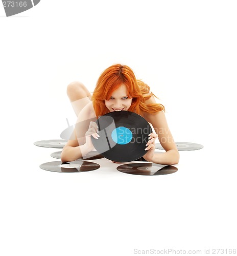 Image of playful redhead with vinyl records