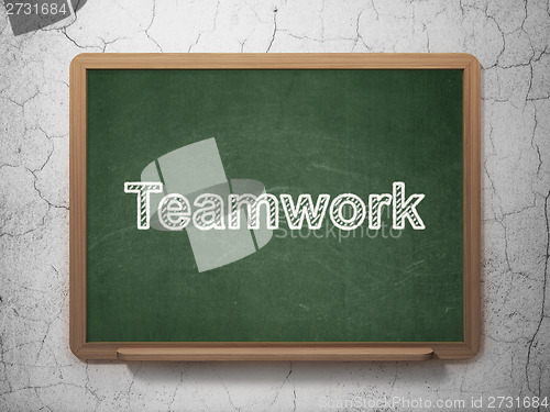 Image of Finance concept: Teamwork on chalkboard background