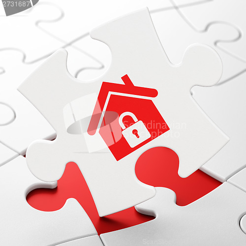 Image of Finance concept: Home on puzzle background
