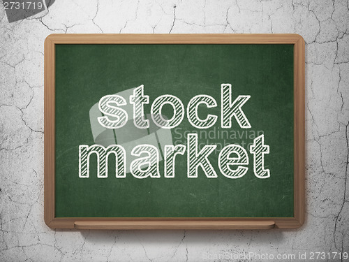 Image of Finance concept: Stock Market on chalkboard background