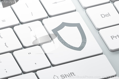 Image of Security concept: Contoured Shield on computer keyboard background