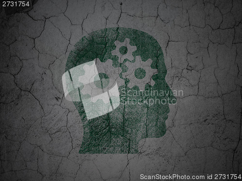 Image of Marketing concept: Head With Gears on grunge wall background