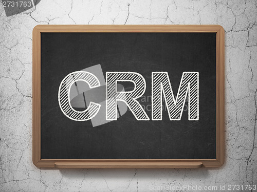 Image of Business concept: CRM on chalkboard background
