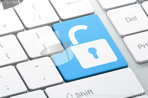 Image of Information concept: Opened Padlock on computer keyboard background