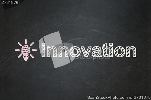 Image of Finance concept: Energy Saving Lamp and Innovation on chalkboard background