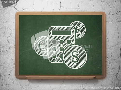Image of Business concept: Calculator on chalkboard background