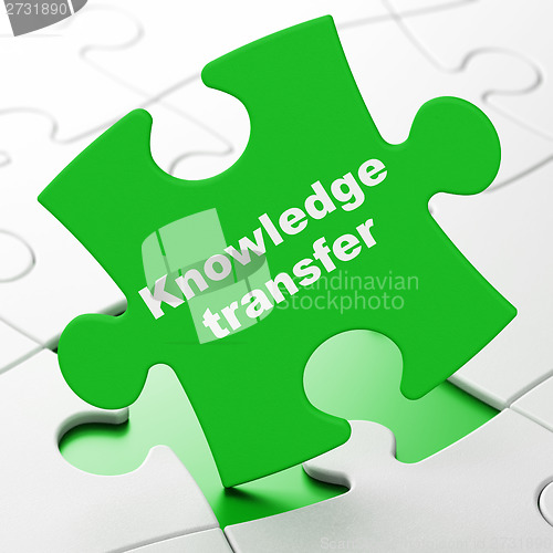 Image of Education concept: Knowledge Transfer on puzzle background