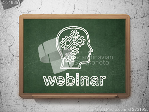 Image of Education concept: Head With Gears and Webinar on chalkboard background