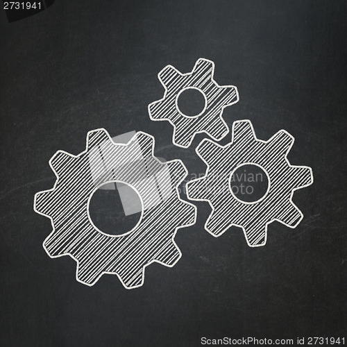 Image of Business concept: Gears on chalkboard background