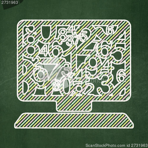 Image of Education concept: Computer Pc on chalkboard background