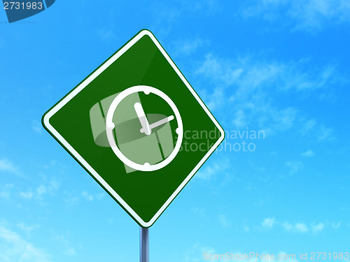 Image of Timeline concept: Clock on road sign background