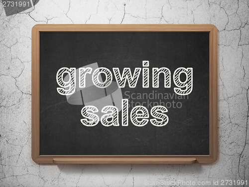Image of Business concept: Growing Sales on chalkboard background