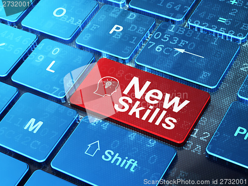 Image of Education concept: Head With Lightbulb and New Skills on computer keyboard background