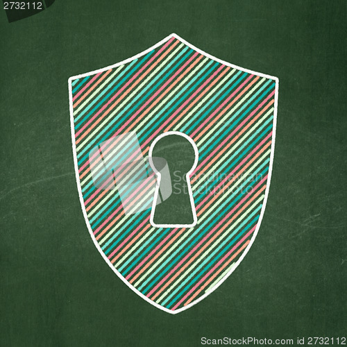 Image of Privacy concept: Shield With Keyhole on chalkboard background