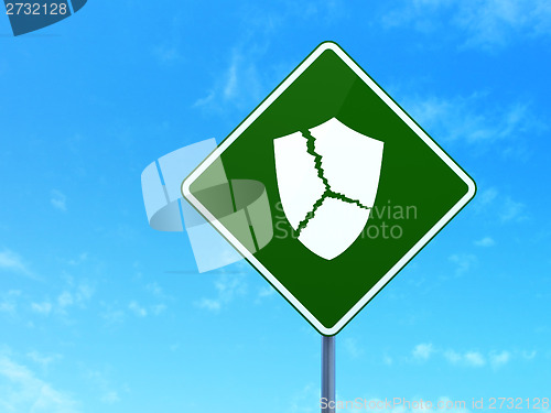 Image of Privacy concept: Broken Shield on road sign background