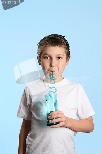 Image of Thirsty boy drinking water