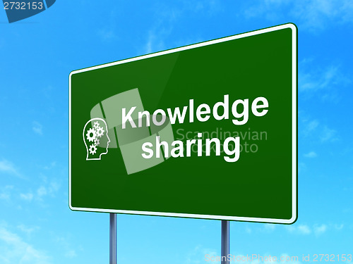 Image of Education concept: Knowledge Sharing and Head With Gears on road sign background