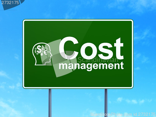 Image of Finance concept: Cost Management and Head With Finance Symbol on road sign background