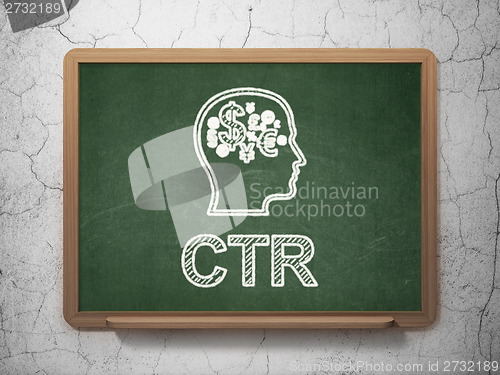 Image of Finance concept: Head With Finance Symbol and CTR on chalkboard background