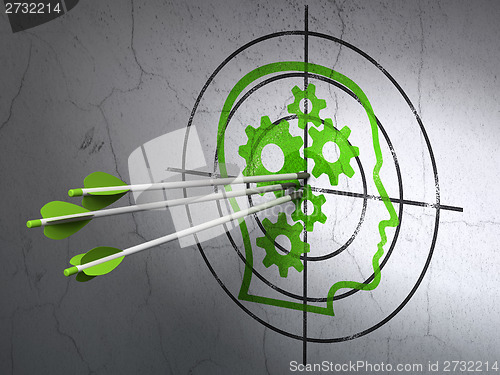 Image of Finance concept: arrows in Head With Gears target on wall background