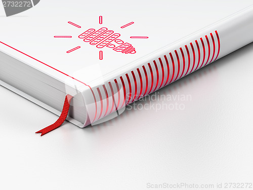 Image of Business concept: closed book, Energy Saving Lamp on white background