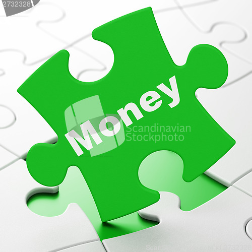 Image of Finance concept: Money on puzzle background