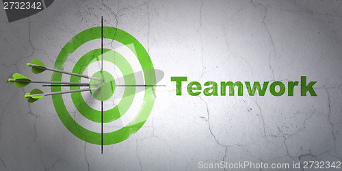 Image of Business concept: target and Teamwork on wall background
