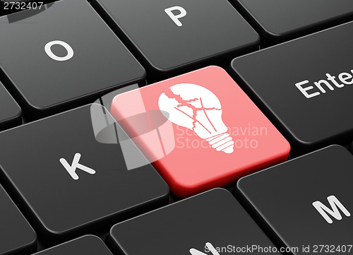 Image of Finance concept: Light Bulb on computer keyboard background