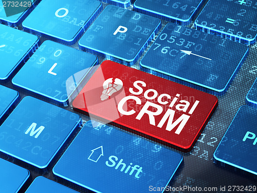 Image of Finance concept: Light Bulb and Social CRM on computer keyboard background