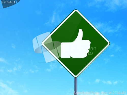 Image of Social media concept: Thumb Up on road sign background