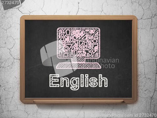 Image of Education concept: Computer Pc and English on chalkboard background