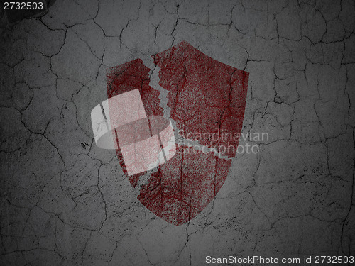 Image of Privacy concept: Broken Shield on grunge wall background