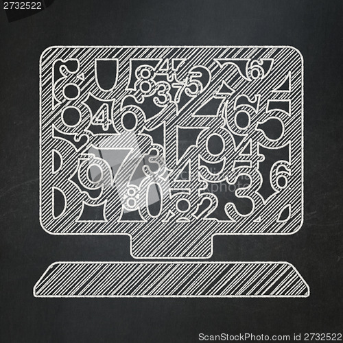 Image of Education concept: Computer Pc on chalkboard background