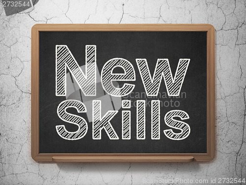 Image of Education concept: New Skills on chalkboard background